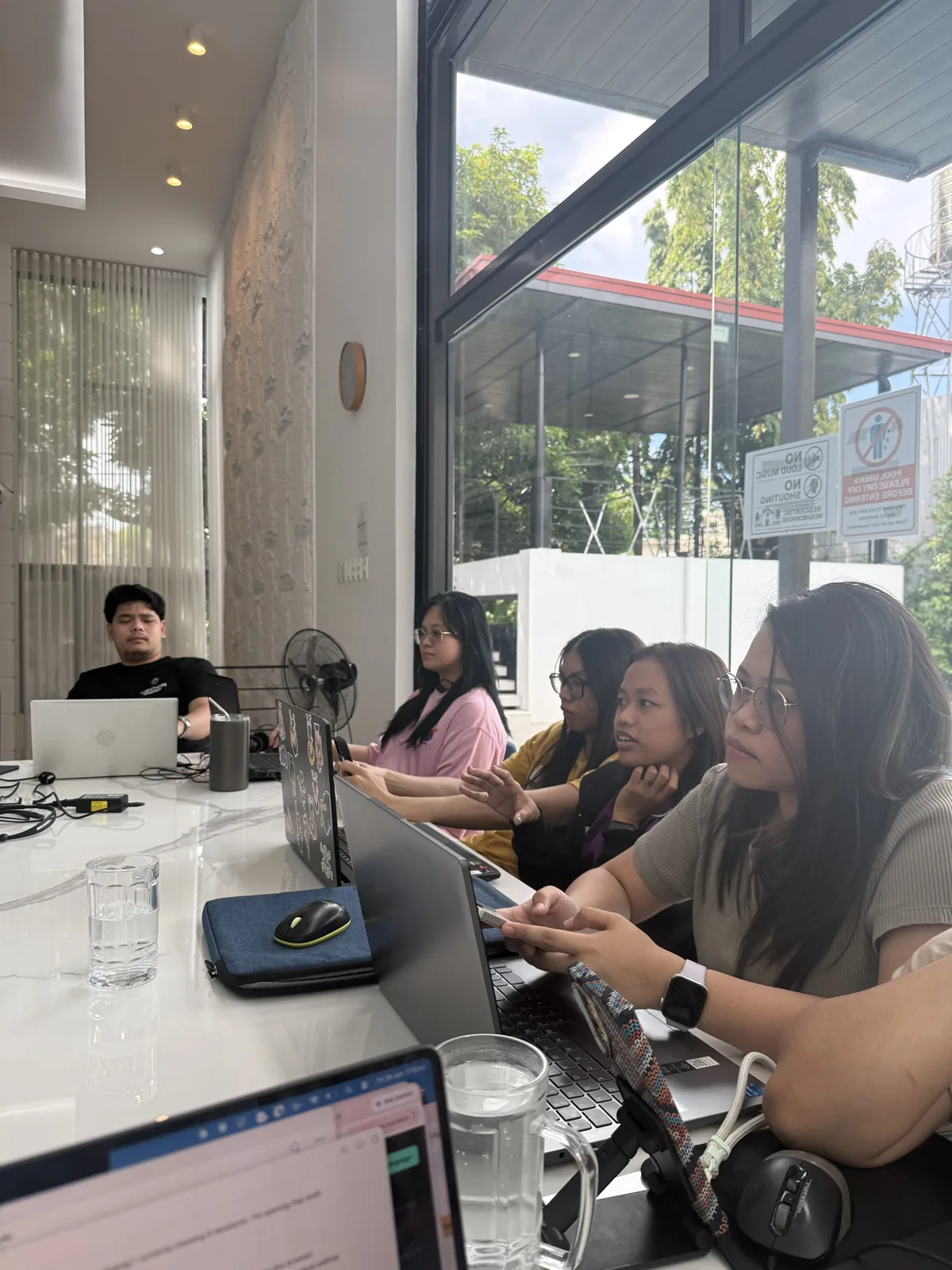 Nexus Group Global reviewing a solar system design during a strategy session