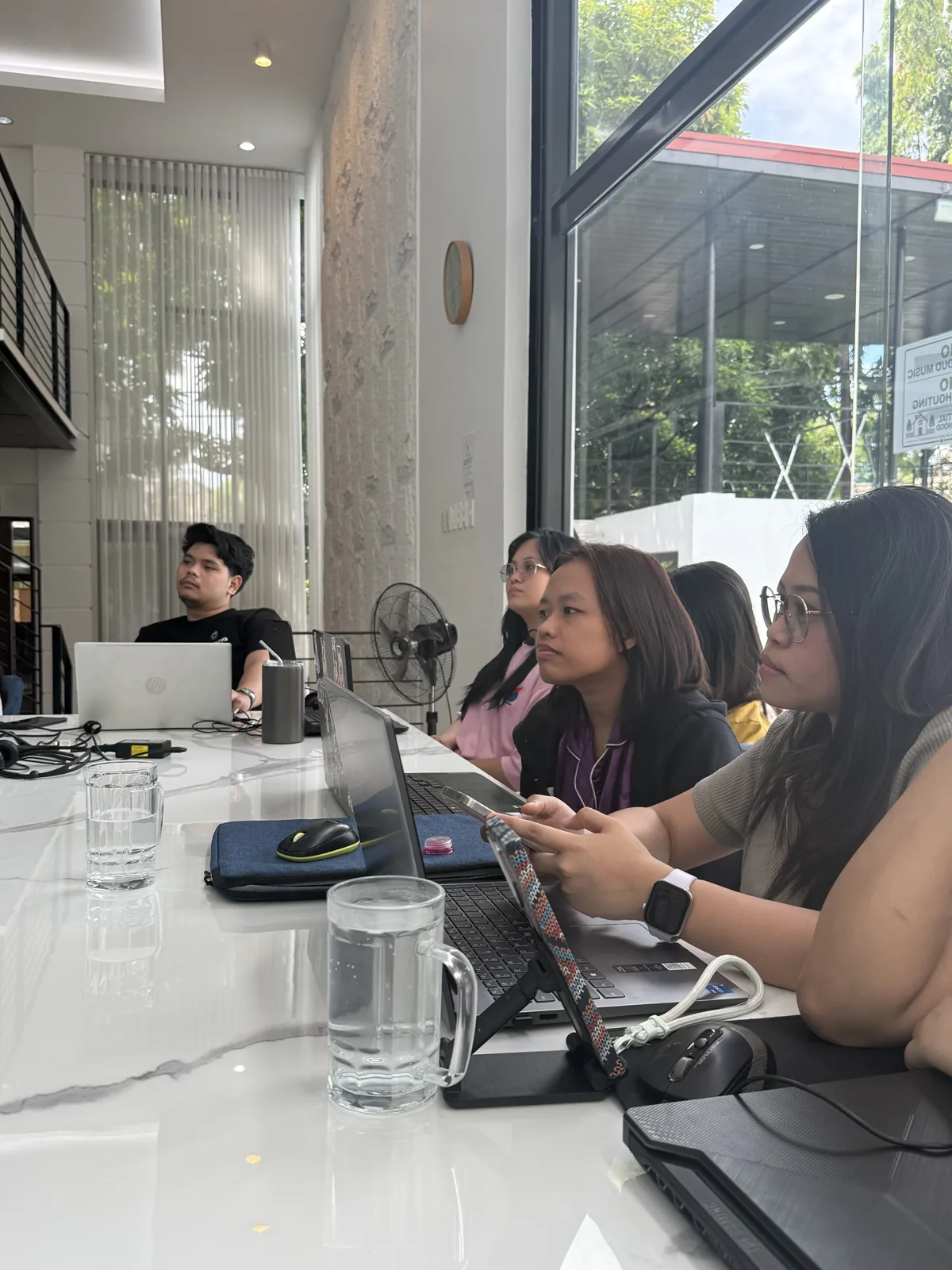 Nexus Group Global virtual assistants working at their laptops during training